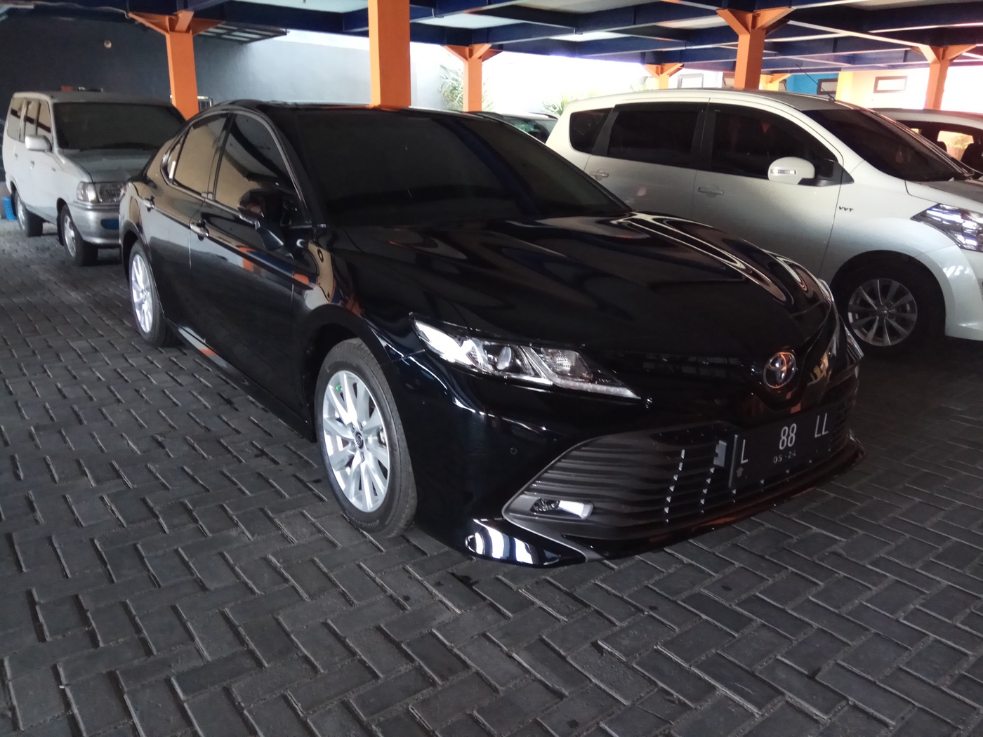 Black 2023 Toyota Camry — front 3/4 view